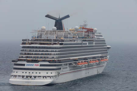 The Caribbean Sea - May 26, 2020: Aerial cloe-up shot of Carnival Vista anchored at sea in the fog. Gray foggy sky in the background.のeditorial素材