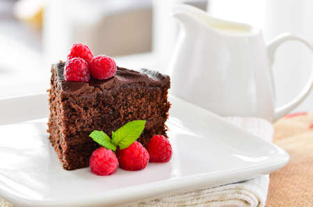 Home made chocolate cake and raspberriesの写真素材
