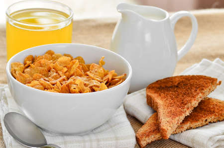 Breakfast cereal with toast and orange juiceの写真素材