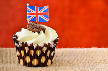 Chocolate cup cake with chocolate flake fondant icing and a Union Jack flagの写真素材