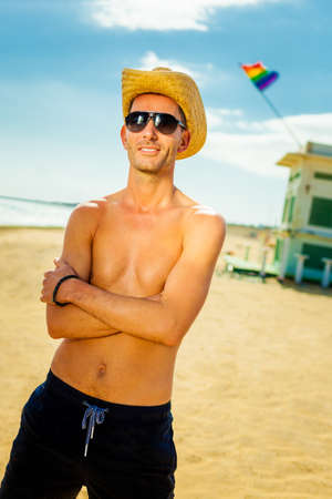 pride young man at a beachの写真素材