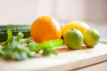 fresh vegetables on wooden kitchen table near the window light