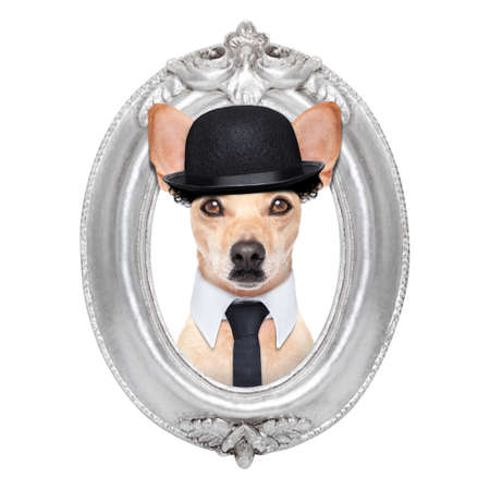 terrier dog portrait of  charlie chaplin, within an old retro wooden frame , isolated on white backgroundの写真素材