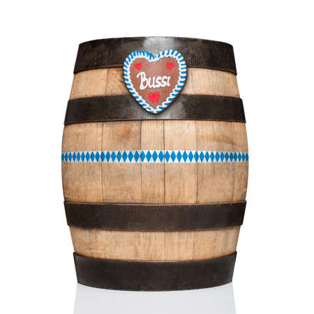 bavarian german beer barrel with  gingerbread heart,   isolated on white background , ready for the beer celebration festival in munichの写真素材