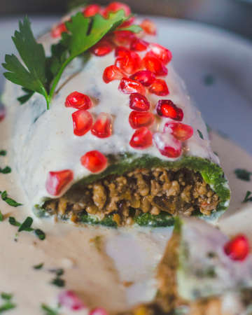 chile en nogada traditional mexican food cut in halfの写真素材