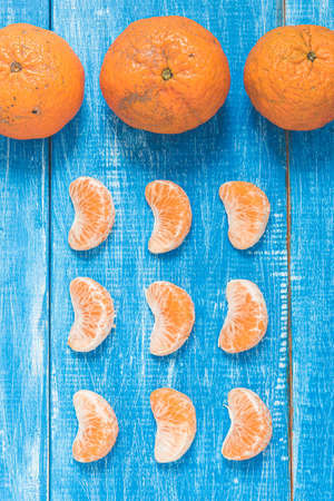 Still life of tangerines in a blue backgroundの写真素材