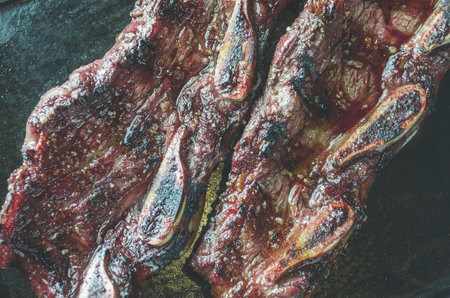 grilled meat with bones traditional in the Argentinian cuisineの写真素材