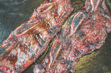 grilled meat with bones traditional in the Argentinian cuisineの写真素材
