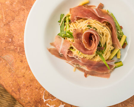 italian pasta linguine with ham and asparagusの写真素材