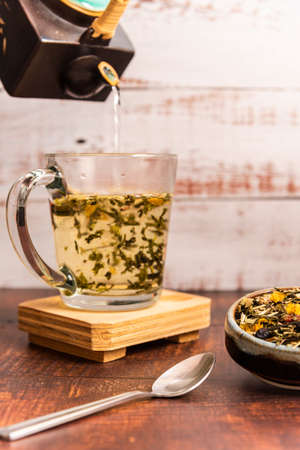 organic green tea on a wooden tableの写真素材