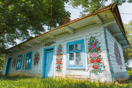 Zalipie, Poland, June 2020: Hand decorated countryside house located in colorful village with open-air museumのeditorial素材