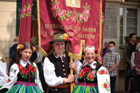 Lowicz, Jun 11, 2020: People dressed in polish national folk costumes from Lowicz region and face...