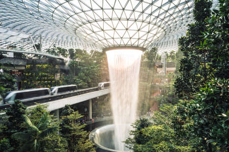Singapore, Nov 2019: Rain vortex. Modern interior of Changi Airport with world's tallest indoor...