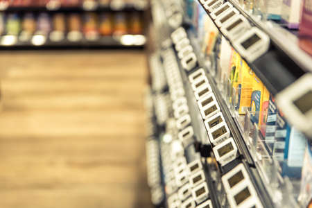 Singapore, Nov 2019: Shelves at supermarket with digital displays for price tags. Electronic shelf label systemのeditorial素材