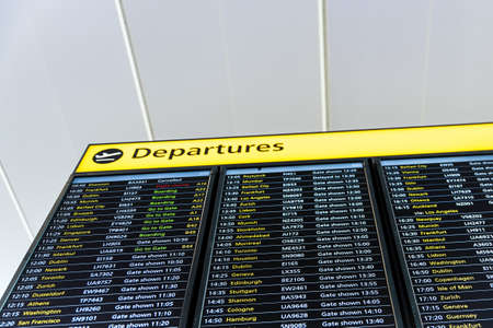 London, Heathrow Airport, August 2019: Departure board displaying flight information - board time,...