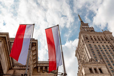 Warsaw, Poland, May 2021: Palace of Culture and Science (PKiN) and Polish flagsのeditorial素材