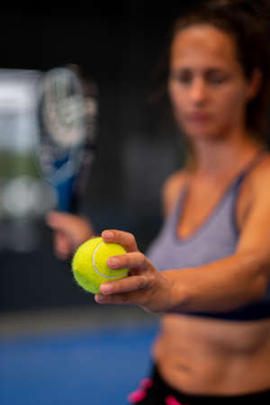 Padel tennis player ready to make the serviceの写真素材
