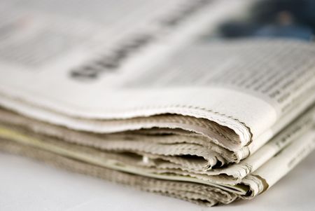 newspaper stack on white background
