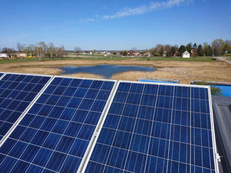 Solar panels on the roof. Sunny day. Clear blue sky.の写真素材