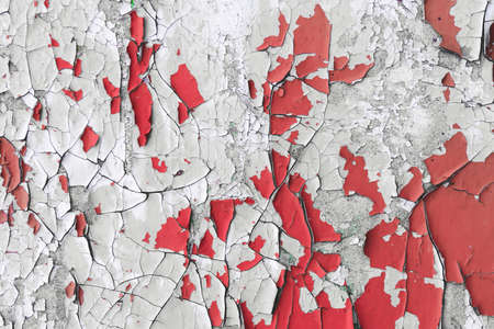 Old white - red wooden wall with cracked paint, background textureの写真素材