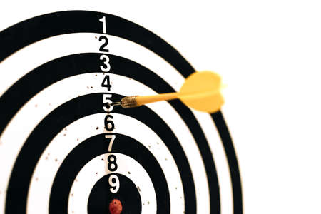 The yellow dart hit the target with the number five. An unsuccessful throw. The desire to win....