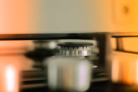 A gas cooker with regulators of level of a flame. A tinted photo. Selective focusの写真素材