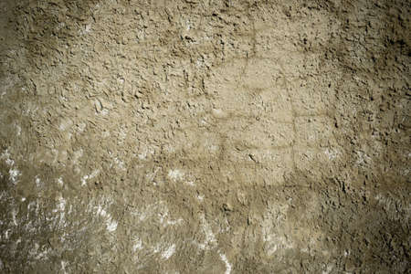 An old plastered wall of a brick building. Background with a cement imageの写真素材