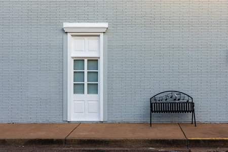 Minimalist Street Scene with Door and musical benchの写真素材