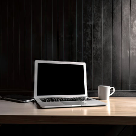 Laptop with blank screen and coffee cup on wooden table. 3d rendering.の素材