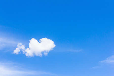 A cloud on a blue sky backgroundの写真素材
