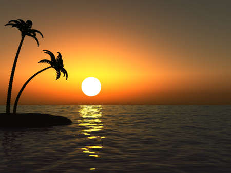 Sunset in the ocean and the desert island with palm treesの写真素材