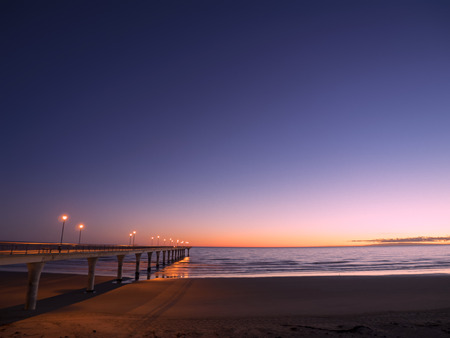 New Brighton Pier Wharf Jetty Sea Ocean Beach Morning Sunrise Lights Christchurch New Zealandの写真素材