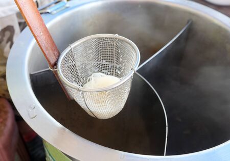 Scald noodles On a hot potの写真素材