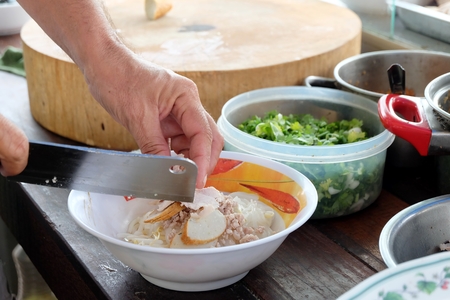 Cooking, Pork noodles with fish ball,hot and sour soup, thai foodの写真素材