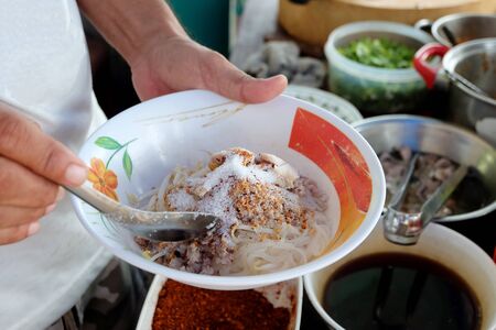 Cooking, Pork noodles with fish ball,hot and sour soup, thai foodの写真素材