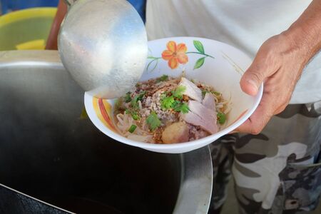Cooking, Pork noodles with fish ball,hot and sour soup, thai foodの写真素材