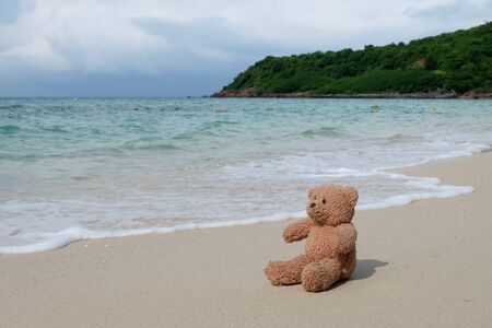 Lonely Teddy bear on the beachの写真素材