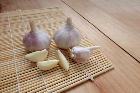 Garlic On wooden matの写真素材