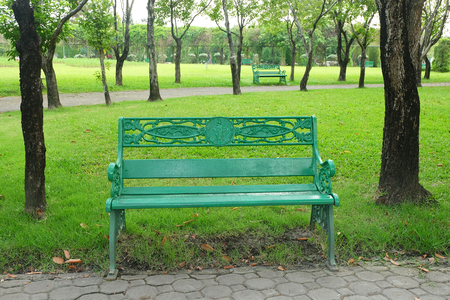 empty green chair in the public parkの写真素材