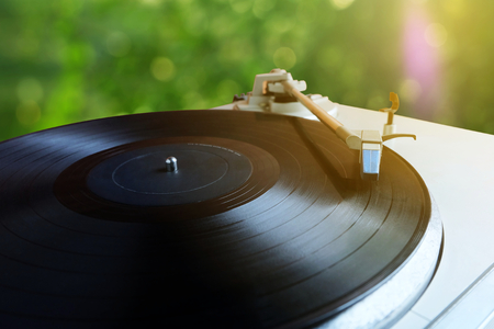 Old retro Vinyl record player.turntable with blurred bokeh backgroundの写真素材