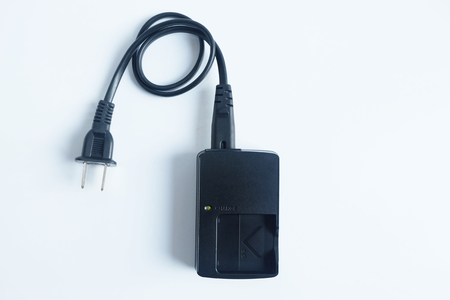 Adapter power charger battery of Camera isolated on white backgroundの写真素材