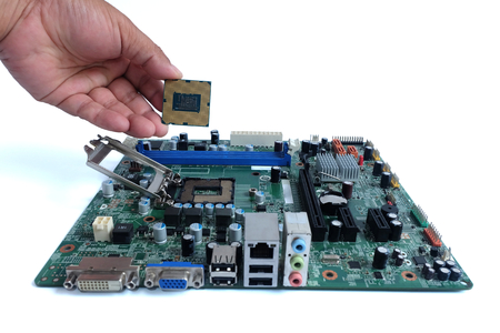 Close up installing cpu and motherboard, parts computer pc,on white backgroundの写真素材