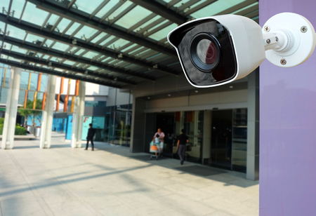 Closeup CCTV Camera of security at blurred a building or shopping mall