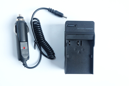 Adapter power charger battery of Camera with Car charger portable on white background.の写真素材