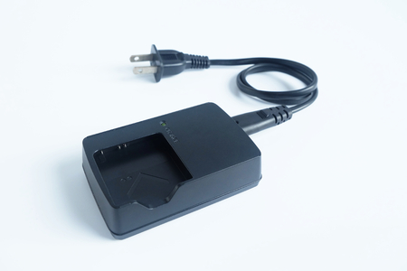 Adapter power charger battery of Camera on white background.の写真素材