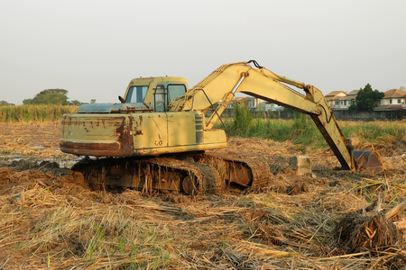 backhoe was digging a pit the ground workingの写真素材