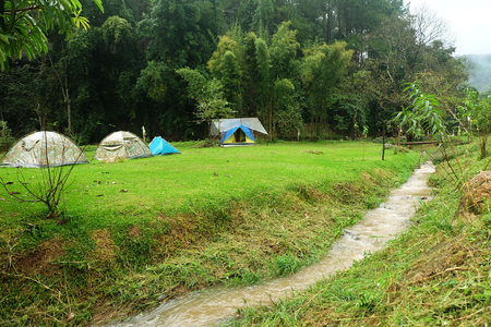 Camping Tent near on the watercourse or Small waterfall at Doi Inthanon, Chiangmai, Thailandの写真素材