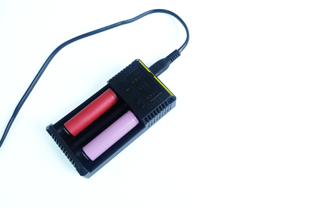 Adapter power charger 18650 Rechargeable Li-ion battery isolated on white background.の写真素材