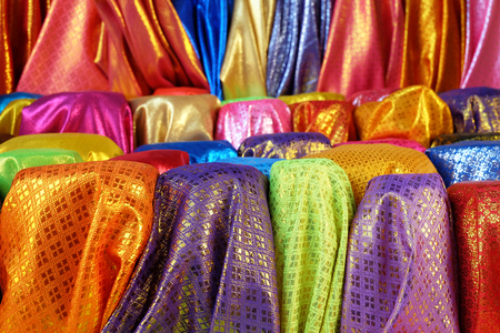 Many Colorful Thai silk with gold pattern color In the local cloth shopの写真素材