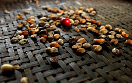 Roasted coffee beans on a bamboo basket